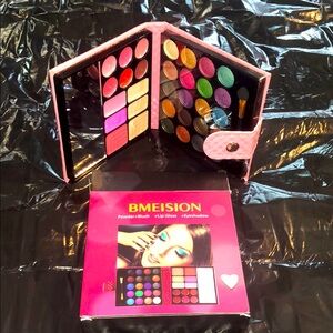 Compact makeup kit in a baby pink case